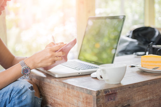 Woman Working Outdoor In Coffee Shop