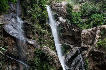 Fototapeta na wymiar Waterfall hidden in the tropical jungle