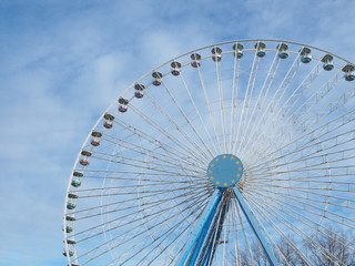 ferris wheel against the blue sky