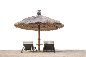 Palm trees on white sandy beach, two sunbed and parasol. View of nice tropical beach.