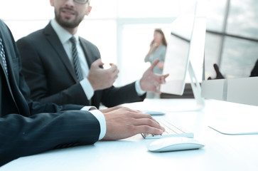 business colleagues sitting at their Desk