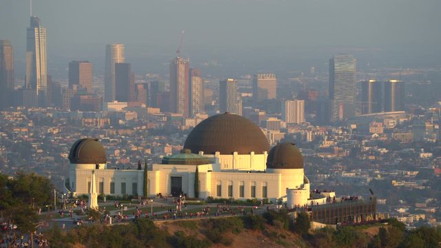Griffith Observatory building and downtown Los Angeles cityscape at sunset - August 2017: Los Angeles California, US