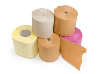 Rolls of various toilet paper different colors on white background
