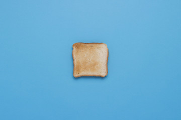One slice of Toast on a blue background.