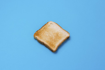 One slice of Toast on a blue background.