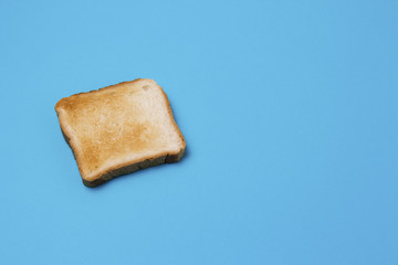 One slice of Toast on a blue background.