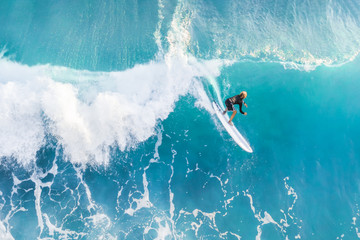 Surfer on the crest of the wave, top view
