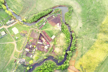 Top view of the winding river and the village