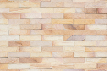Brick wall art concrete or stone texture background in wallpaper limestone abstract paint to flooring and homework/ Brickwork or stonework clean grid uneven interior rock old.