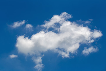 White fluffy clouds in the blue sky background