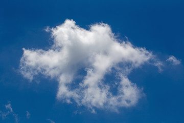 White fluffy clouds in the blue sky background
