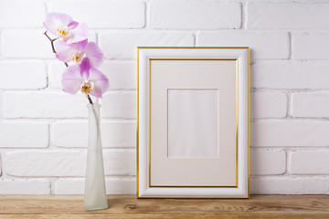 Gold decorated frame mockup with tender pink orchid