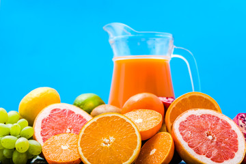 Freshly squeezed fruit juice. Healthy juicy vitamin drink, refreshing summer beverage with citrus fruits