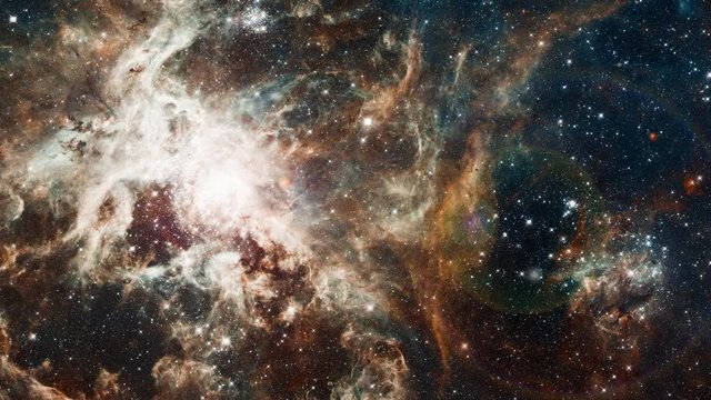Space flight to Tarantula nebula, 3D animation with moving stars rotating stars field and light flares explosions. Contains public domain image by NASA