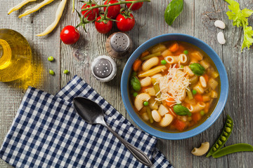 Minestrone soup with pasta and cheese.