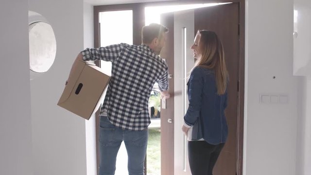 Couple With Boxes Moving Out