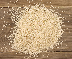 White sesame  on wooden background