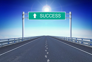 Straight highway with footprints and text Success on the road sign. Concept of movement to successful life