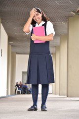 Obraz na płótnie Canvas Laughing Cute Female Student Wearing Uniform