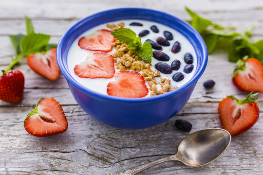 A delicious and healthy breakfast of yogurt with fresh fruit.
