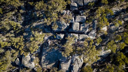 Obraz premium Aerial drone view over wineries and granite rock in Stanthorpe, Australia