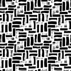 Seamless abstract pattern with brush strokes. Hand-painted texture. Black brushstrokes on a white...