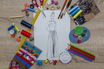 Fototapeta premium Creative Fashion Design desk with sketch and accessories