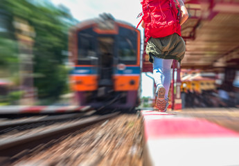 motion blur of rush on running step in hurry up of tourist to get on the last train leaving from the station