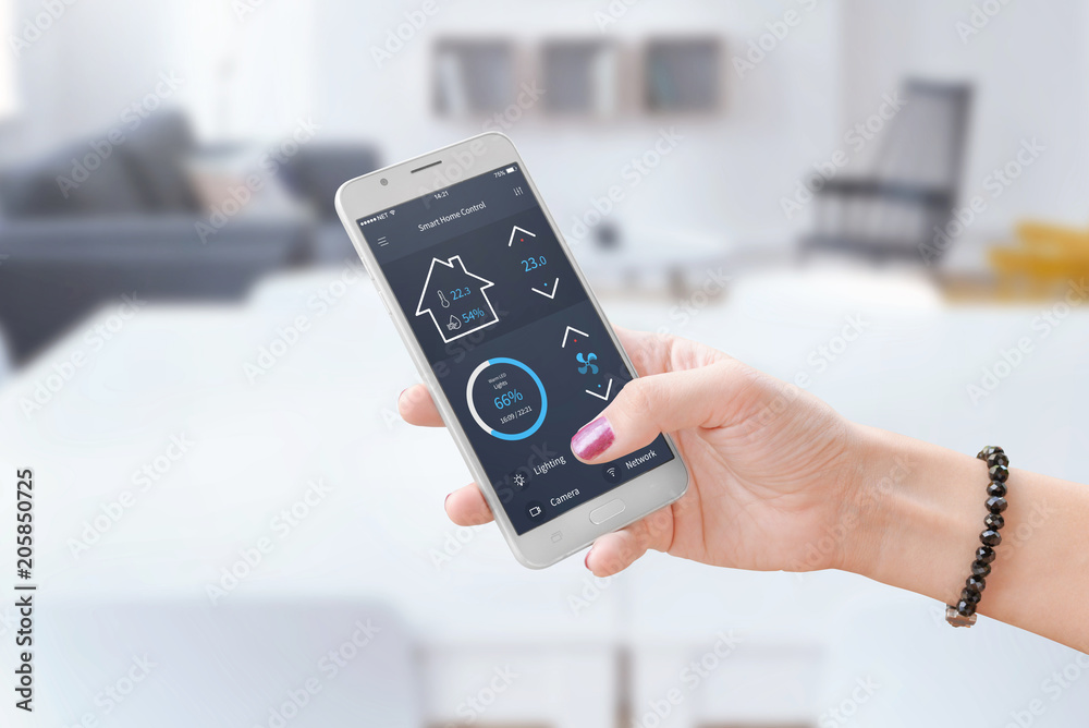 Poster Woman hold smart phone and use smart home control app to monitoring home parameters.