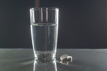 Effervescent tablet in water with bubbles