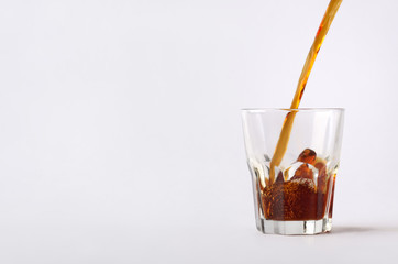 The close-up composition with the dynamic flow of hot coffee  beverage.