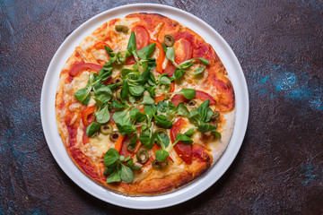 Vegetarian pizza on dark background, copy space