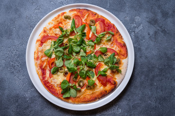 Vegetarian pizza on grey background, copy space