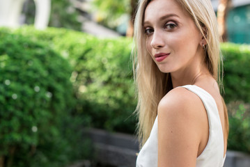 Naklejka premium Young pretty woman looking back