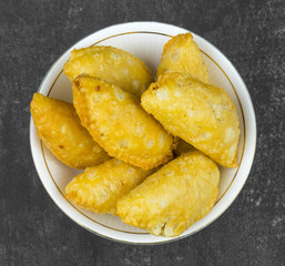 Gujiya or Gujia is a indian sweet dumpling made with suji, Maida or wheat flour and stuffed with khoya. It is common in North India, particularly in Bihar, Uttar Pradesh, Madhya Pradesh or Rajasthan