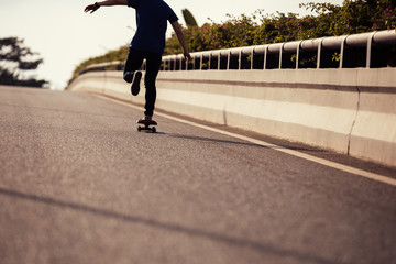Skateboarder skateboarding on city street