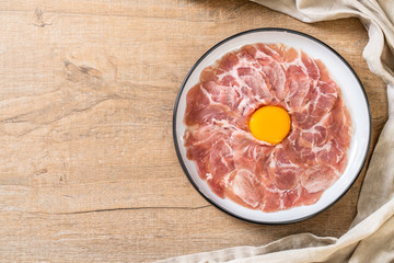 fresh sliced pork raw with egg