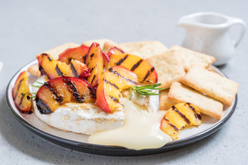 Baked Camembert cheese with grilled peach