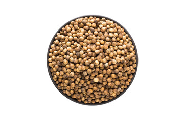 coriander seed in clay bowl isolated on white background. Seasoning or spice top view