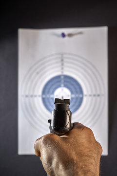 shooting from the gun on the target. shot at the target. target hit. 
