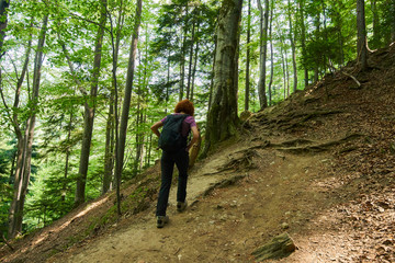 Woman hiking on a mountain trail