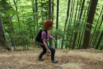 Woman hiking on a mountain trail