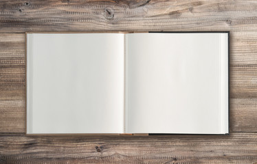 Open book wooden background Minimal flat lay - obrazy, fototapety, plakaty