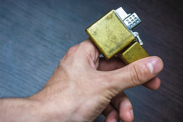 hand-held golden folding lighter