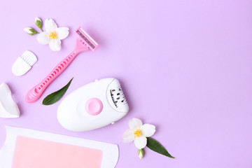 a set of different means for epilation on a colored background. Removal of unwanted hair. Modern epilator, wax strips, razor. Minimalism, top view. flatlay 