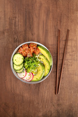 Hawaiian tuna poke salad with wakame and copy space