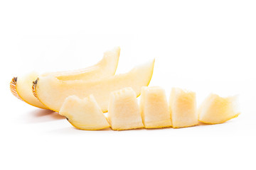 Sliced honeydew melon tropical fruit isolated on a white background.