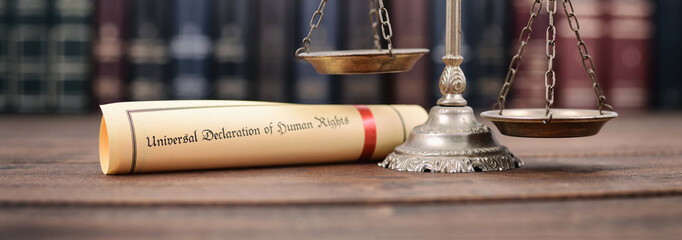 Scales of Justice, Universal declaration of human rights on a wooden background, human rights...