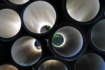 Pipes inside view, shiny metallic surface background