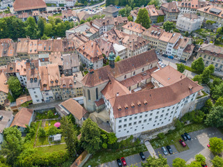 Fototapeta premium Aerial view of old medieval city of Fribourg in Switzerland on a beautiful summer day